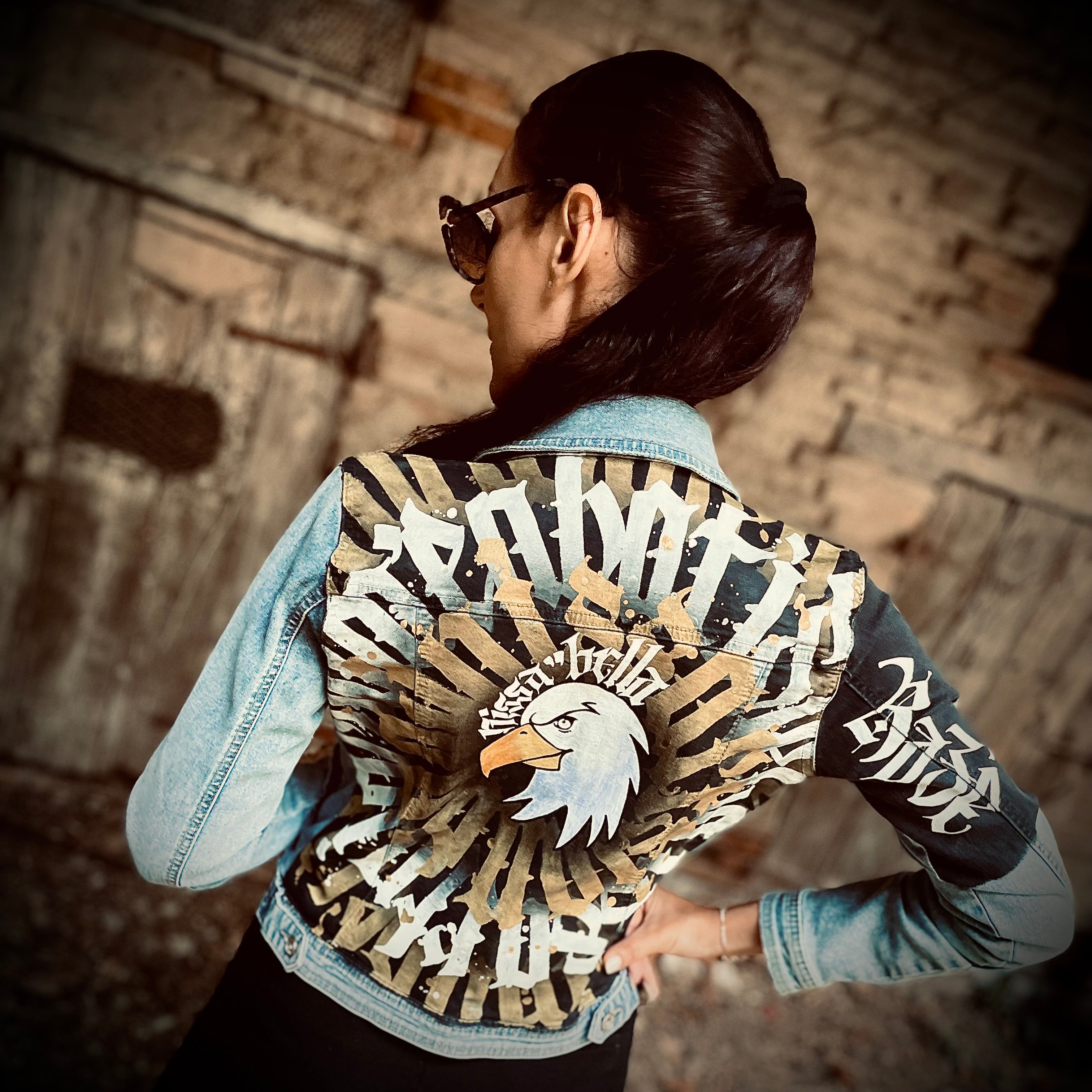 Hand-painted denim jacket by Niçois artist Razé, featuring calligraffiti inspired by Nice, spirituality and combat sports. Unique wearable artwork, some pieces ritually blessed by a shaman or priest.