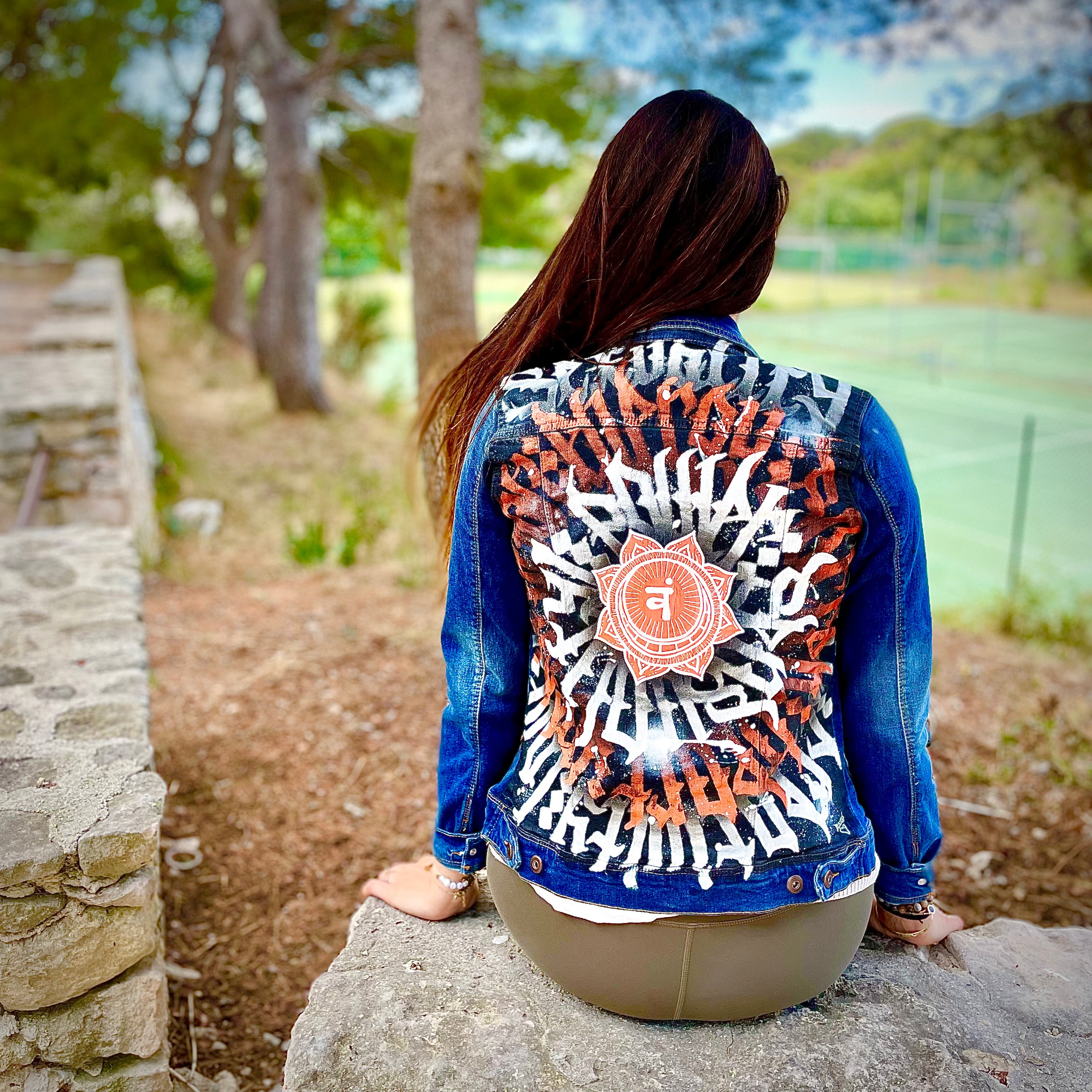 Hand-painted denim jacket by Niçois artist Razé, featuring calligraffiti inspired by Nice, spirituality and combat sports. Unique wearable artwork, some pieces ritually blessed by a shaman or priest.